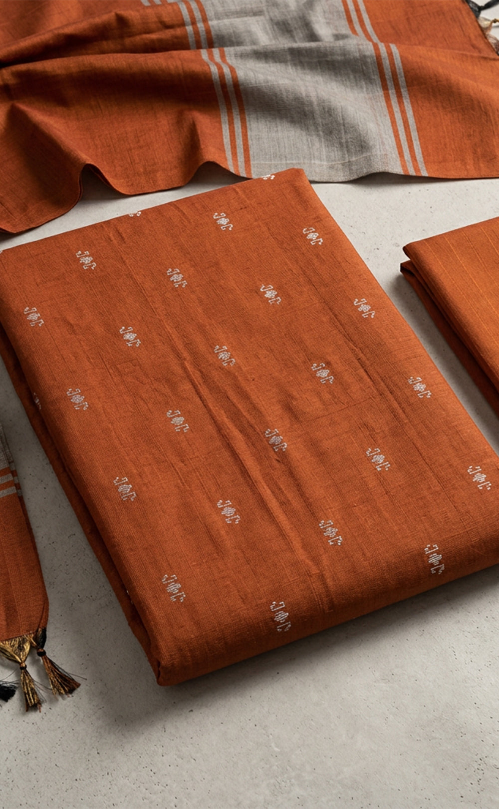 Rust Orange Fancy Ikkat Buti Work Un-Stitched Dress Material